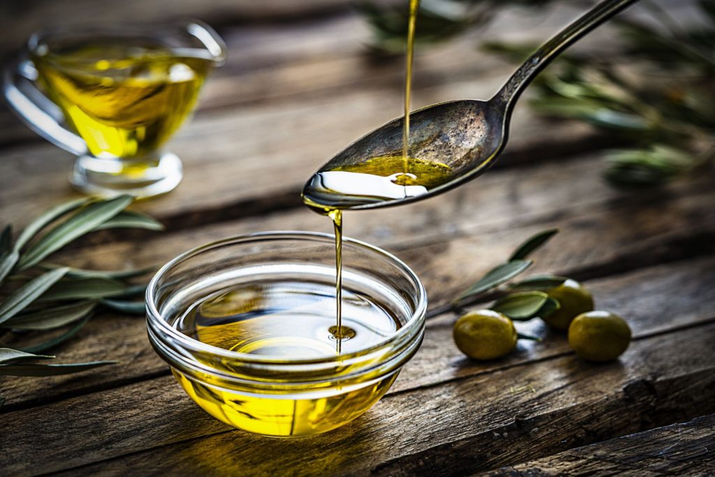 pouring-extra-virgin-olive-oil-royalty-free-image-1597238508-1024×683